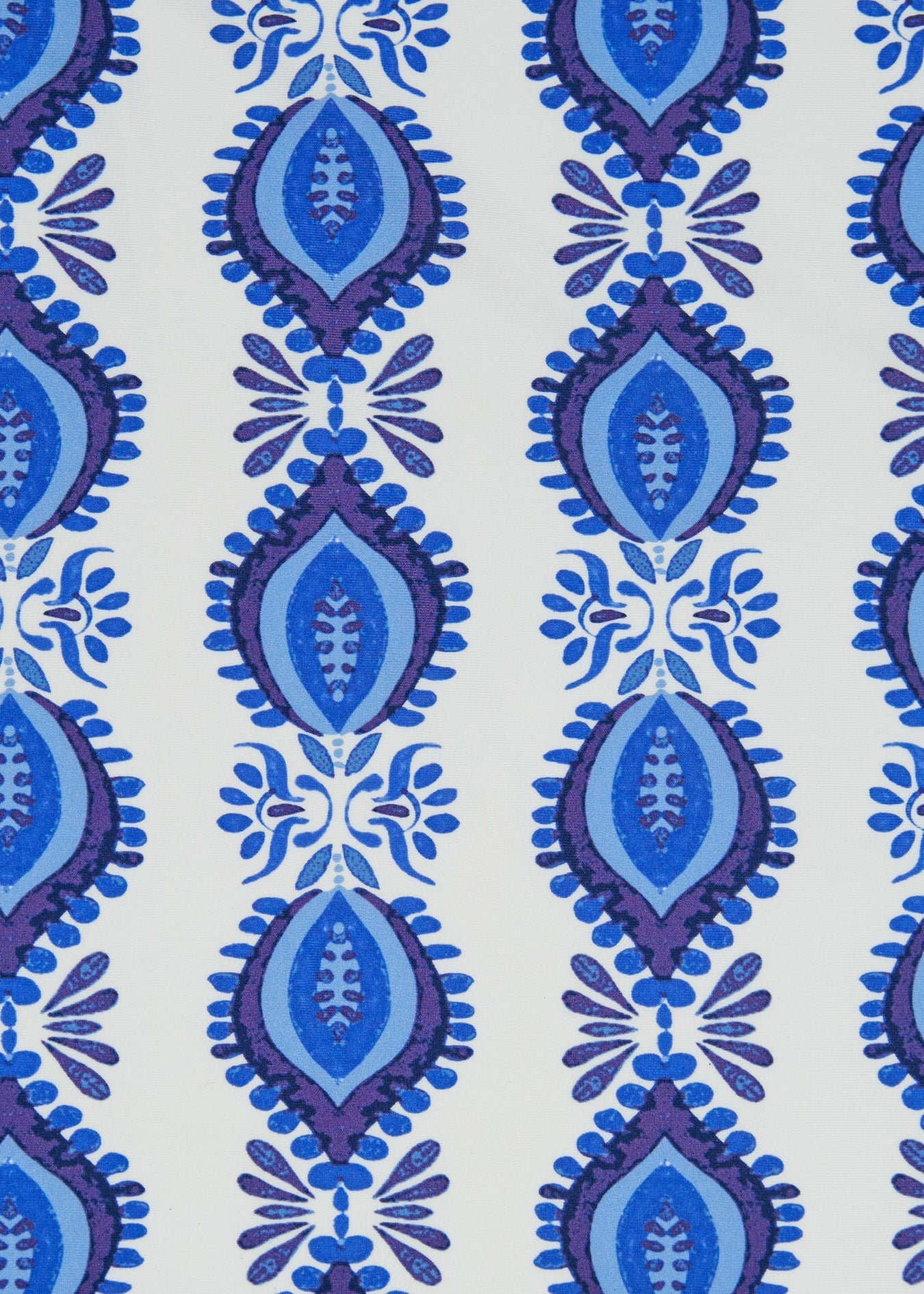 Patterned fabric with blue and purple design on a white background