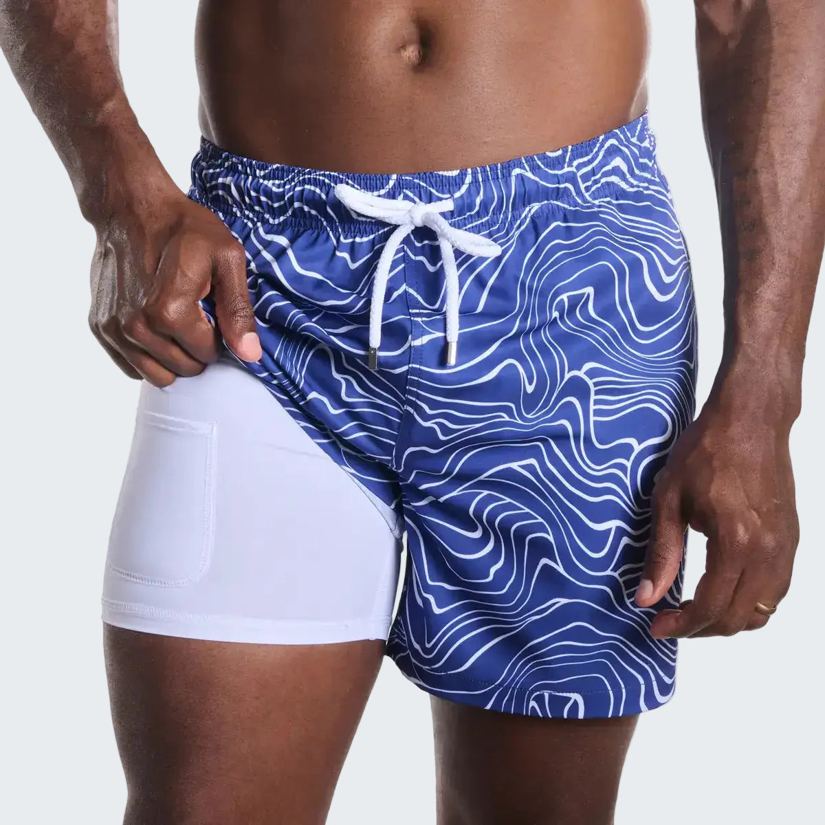Blue swim shorts with white pattern and drawstring on a white background