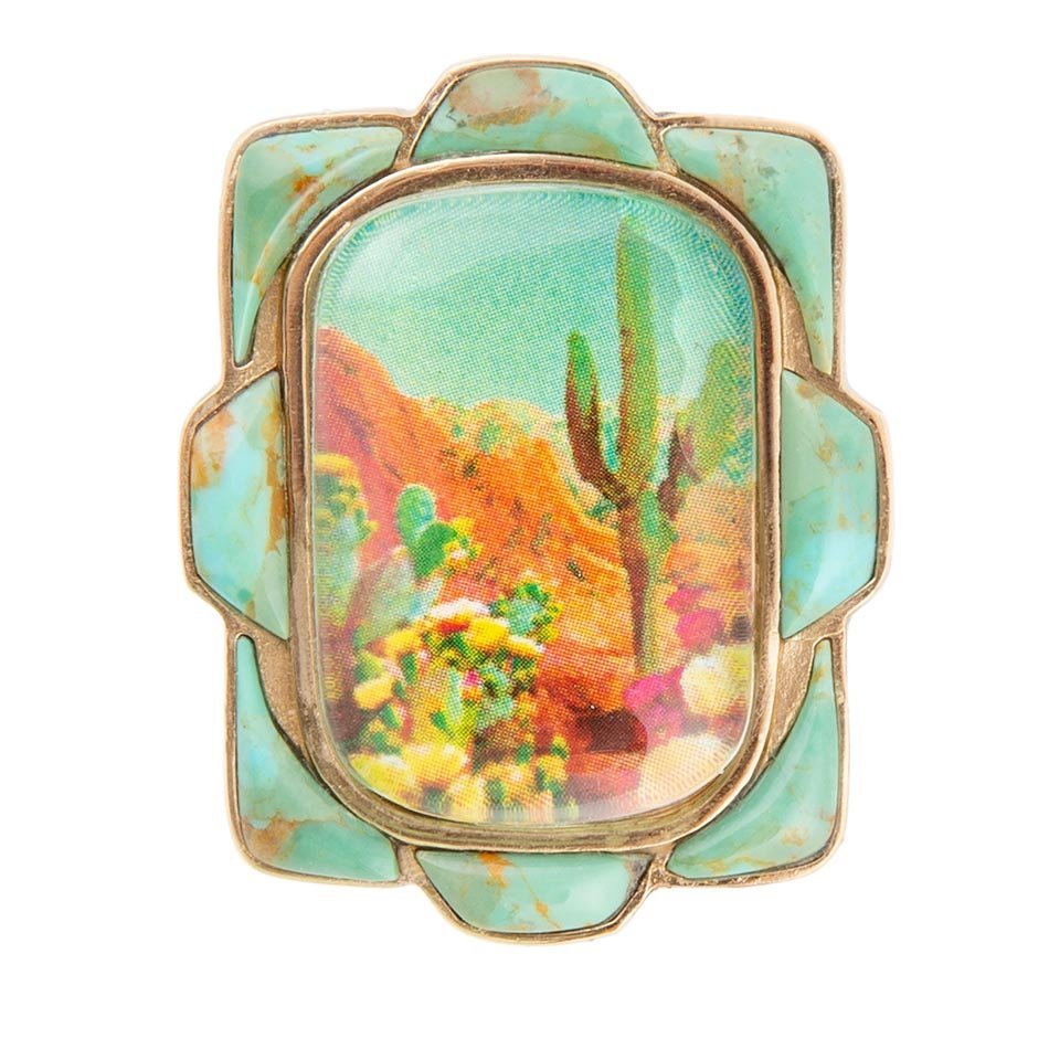 Ring with a desert landscape design on a white background