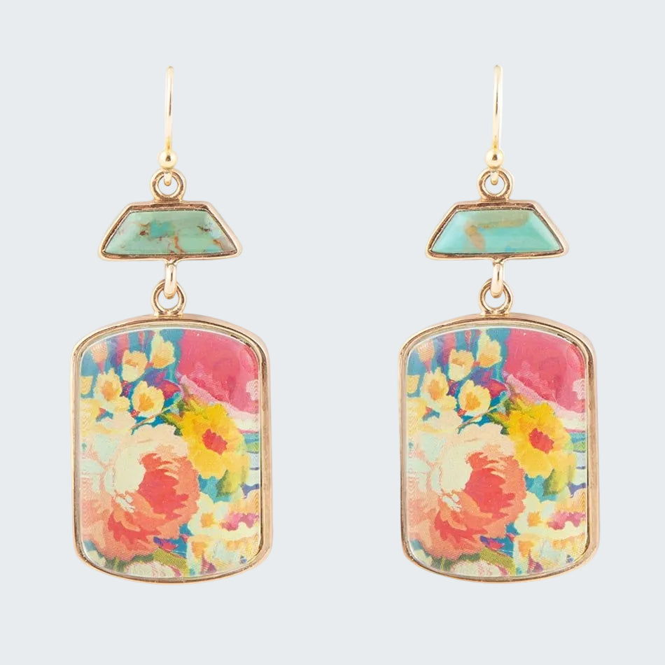 Colorful floral earrings with gold accents on a white background