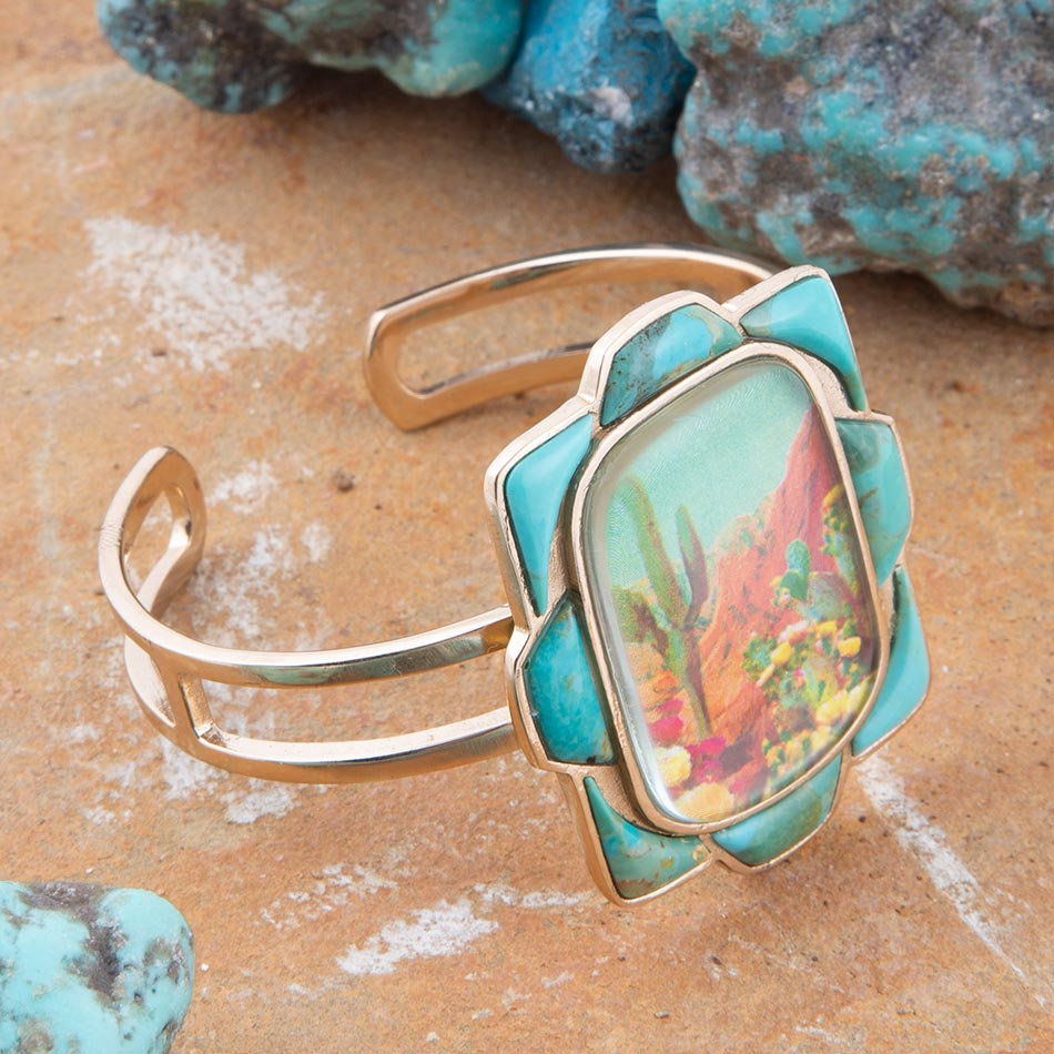 Turquoise stone bracelet with gold frame on a natural stone background