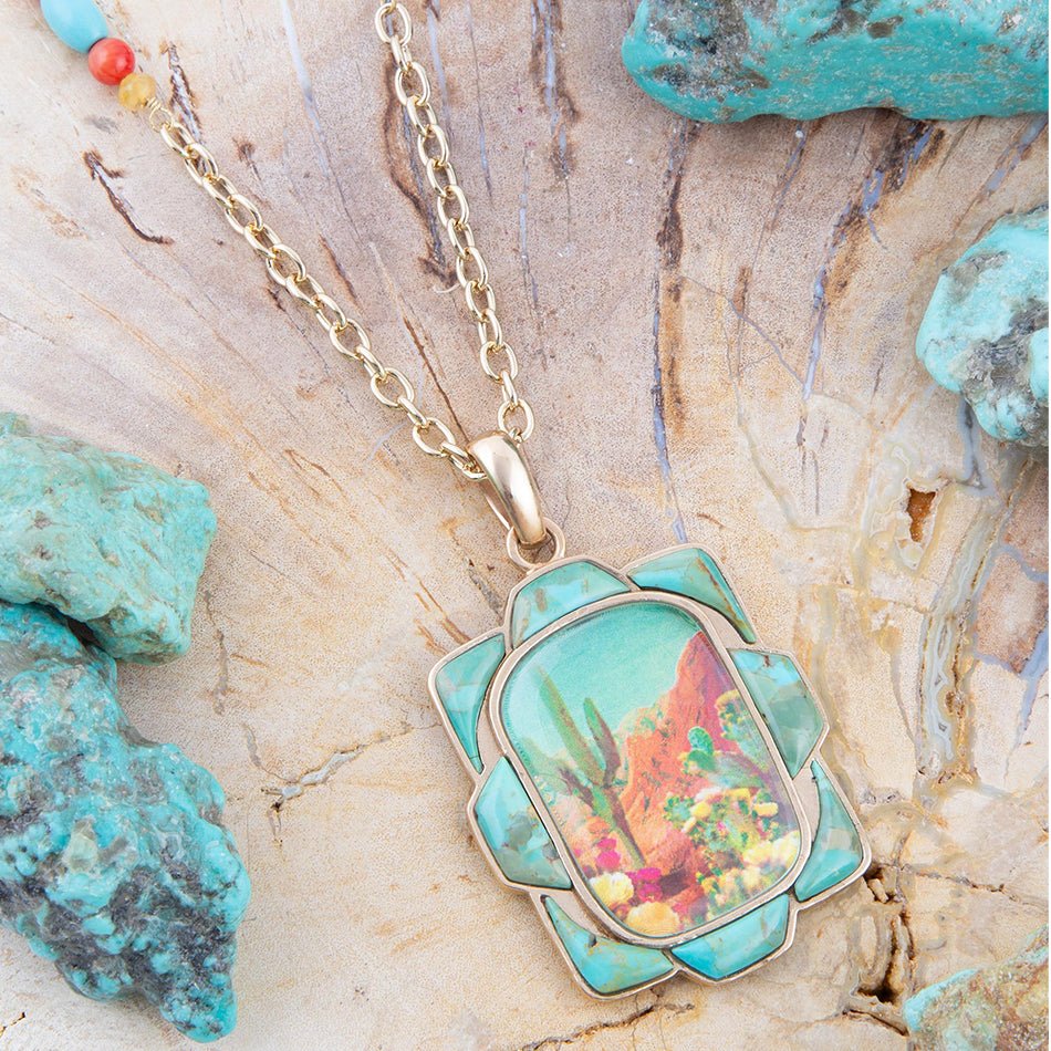 Turquoise pendant necklace with coral design on a stone surface