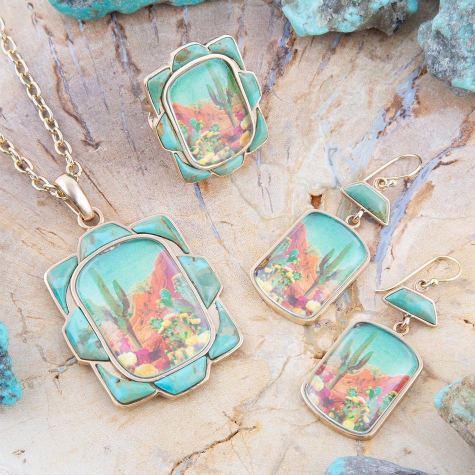 Jewelry set with pendants and earrings on a stone surface