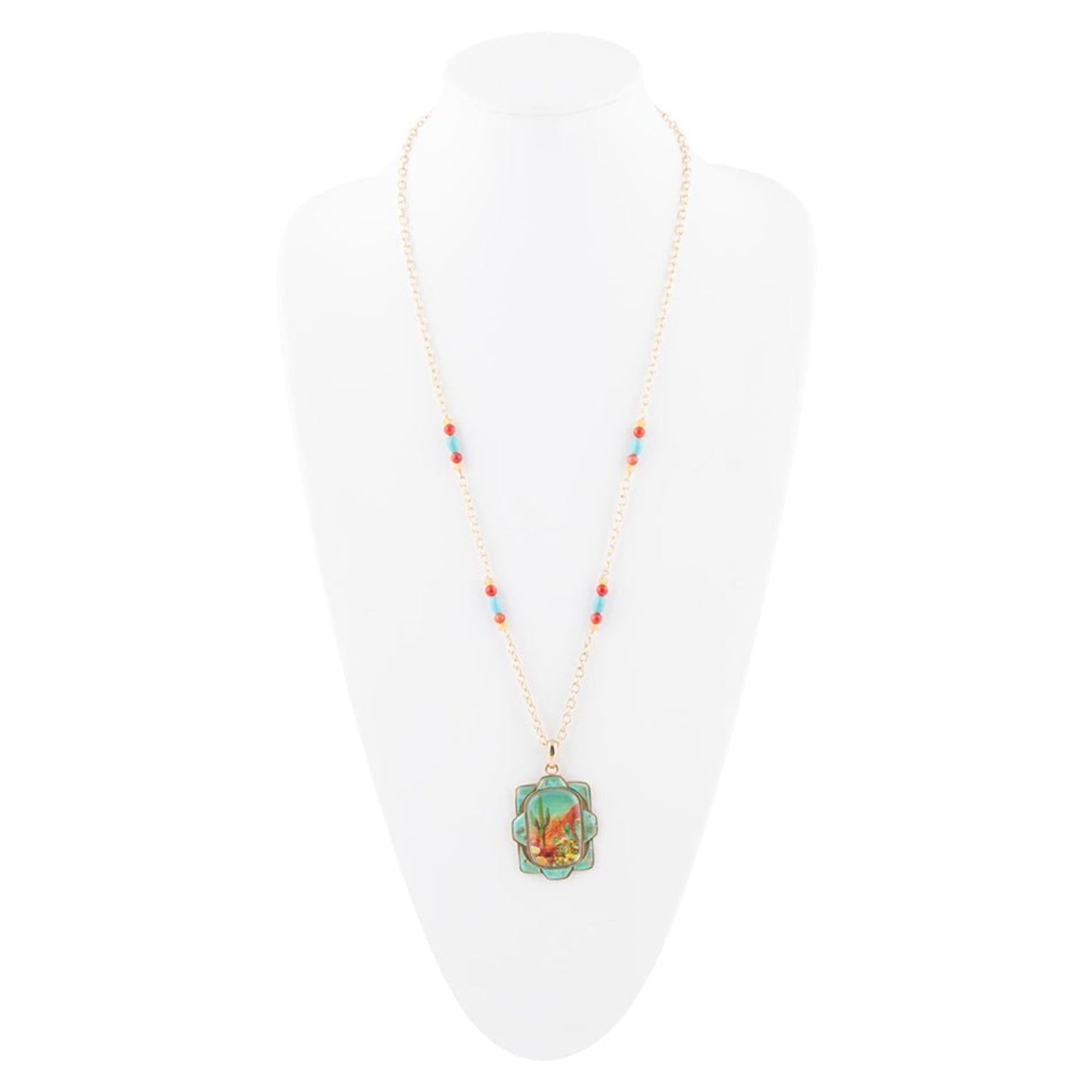 Necklace with a pendant on a white mannequin bust