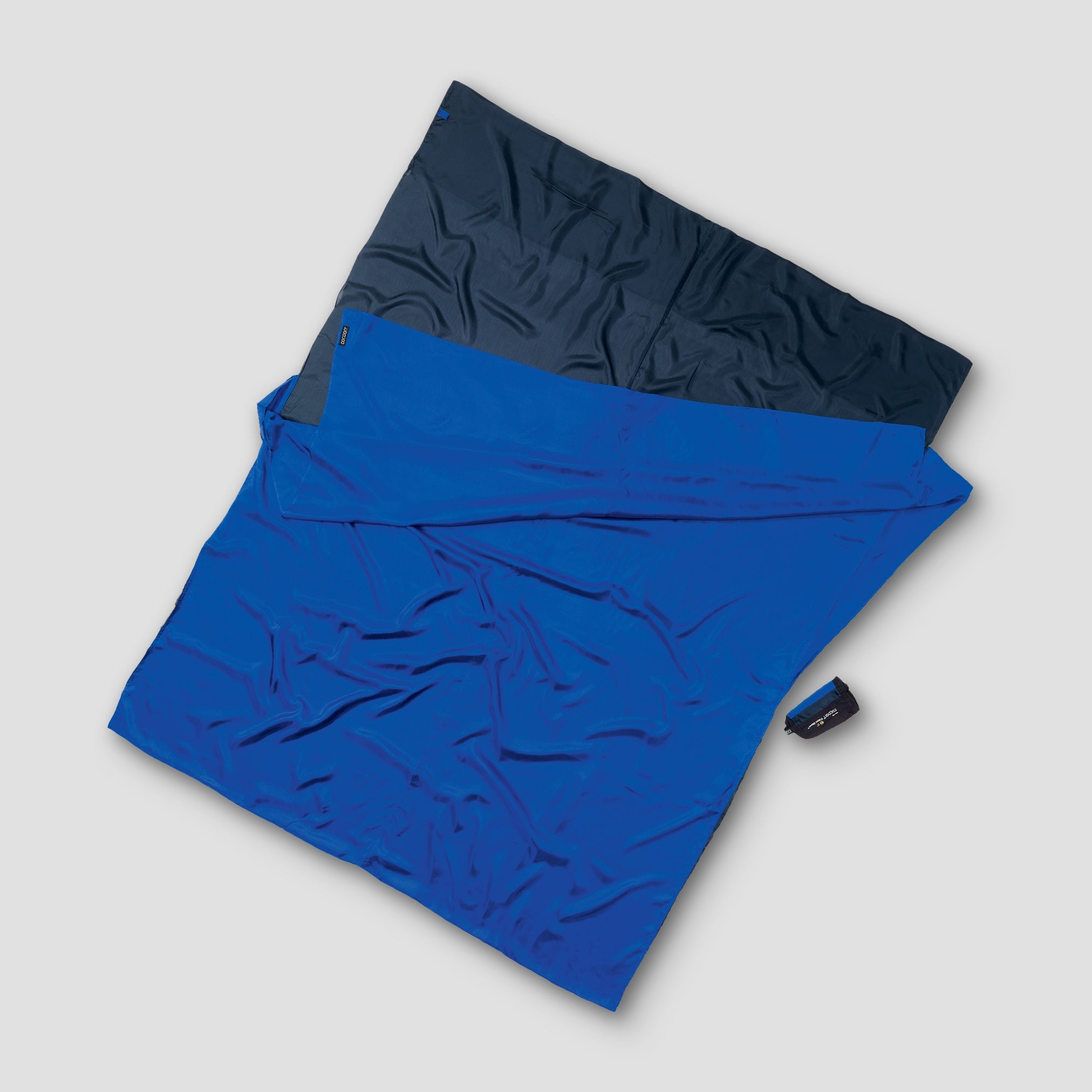 Blue and navy fabric on a light gray background