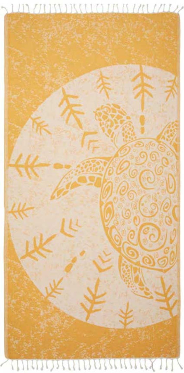 Towel with turtle design on a yellow background