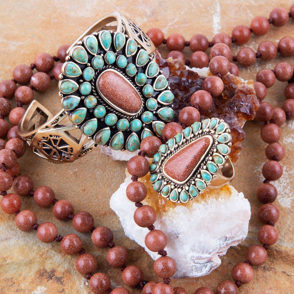 Bracelets with turquoise stones and brown beads on a stone surface