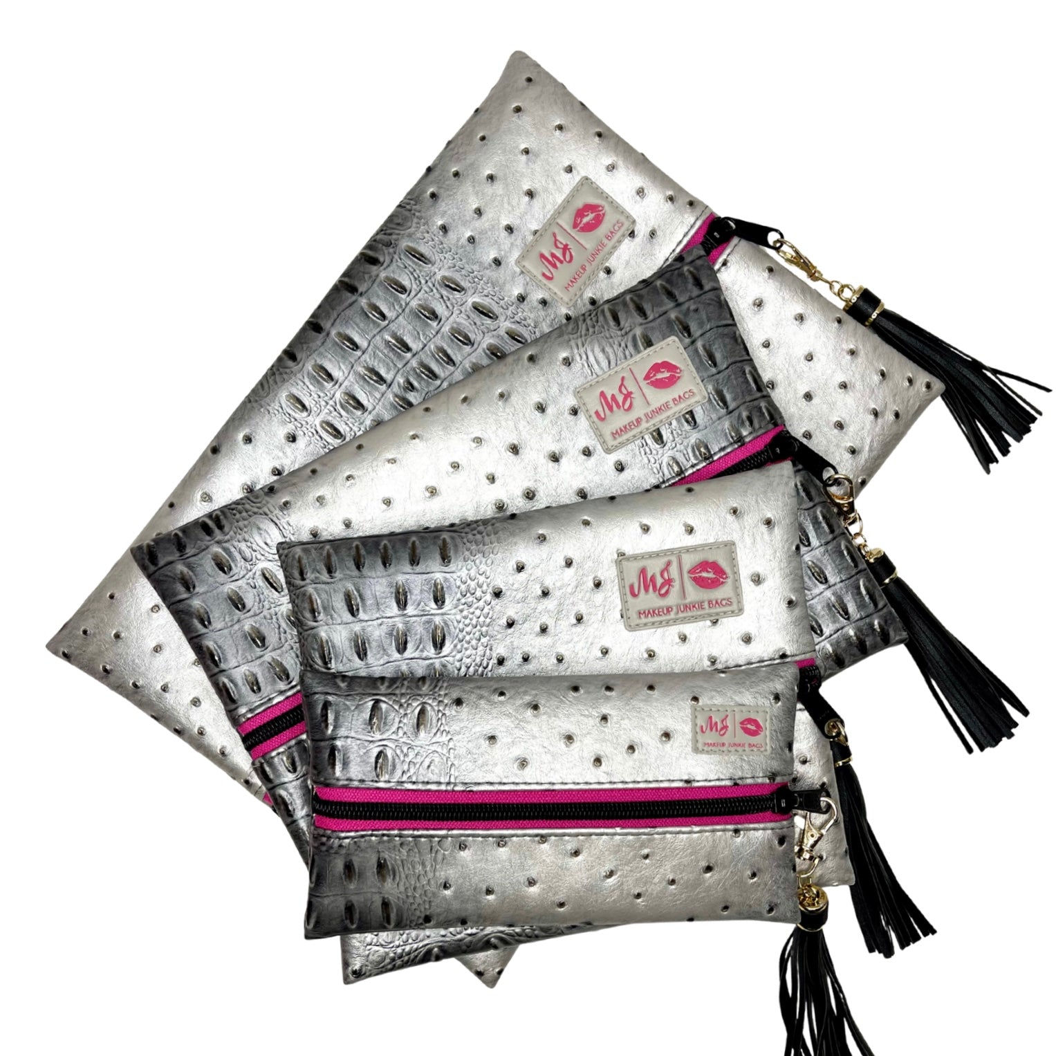 Silver clutch bags with tassels and visible branding on a white background