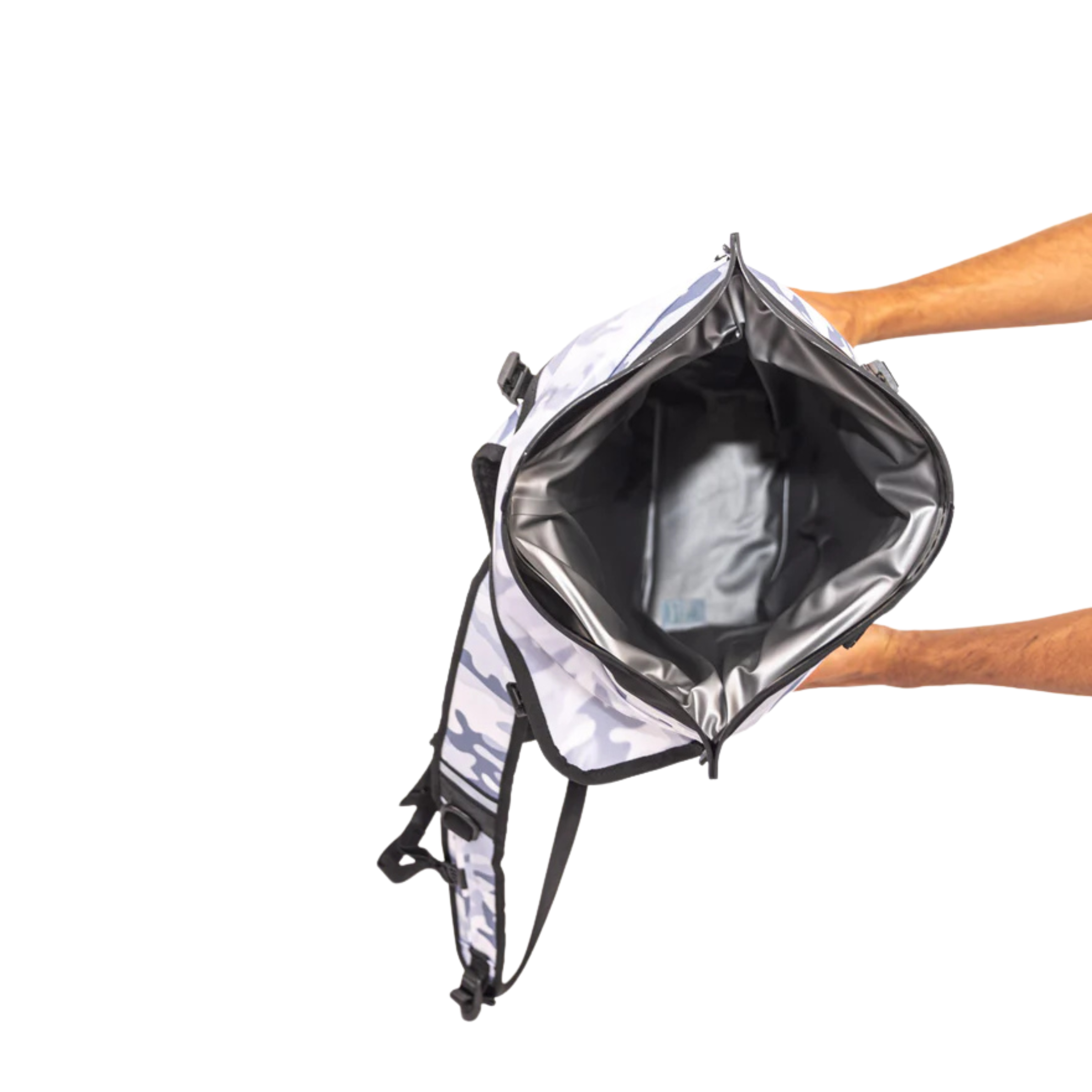 Person holding a reflective backpack on a white background