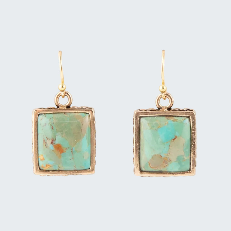 Turquoise square stone earrings with gold frames on a white background