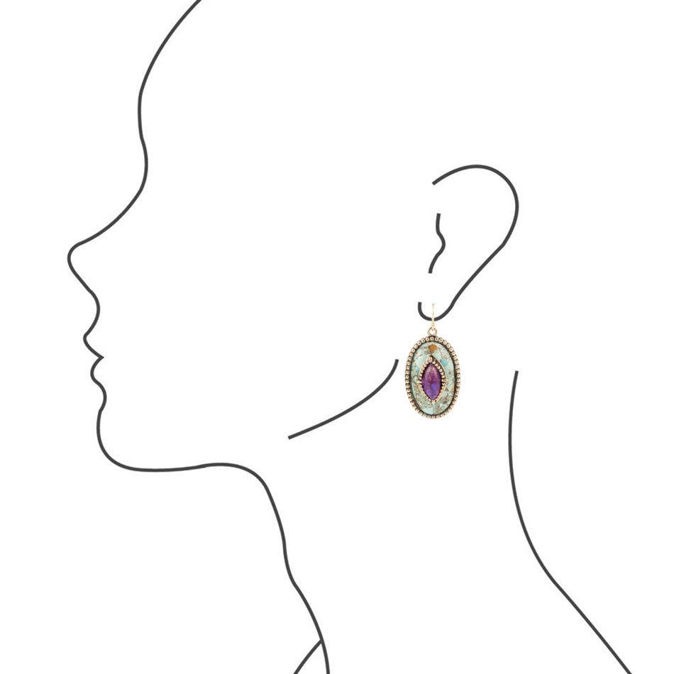 Earring worn on a person's ear with a white background