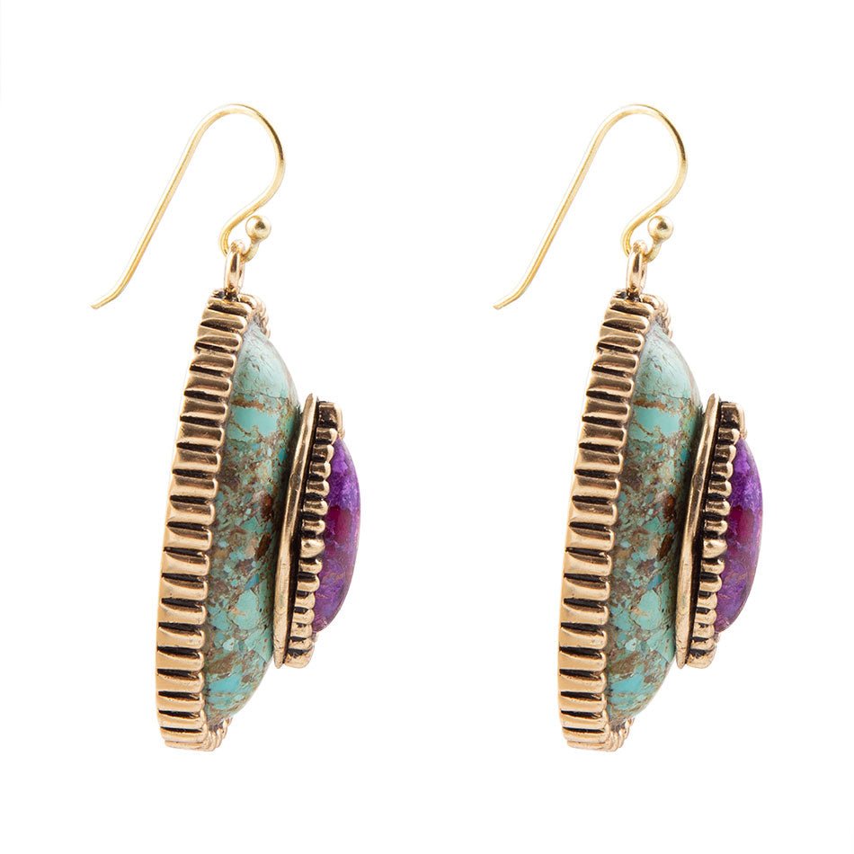 Pair of earrings with turquoise and purple stones on a white background