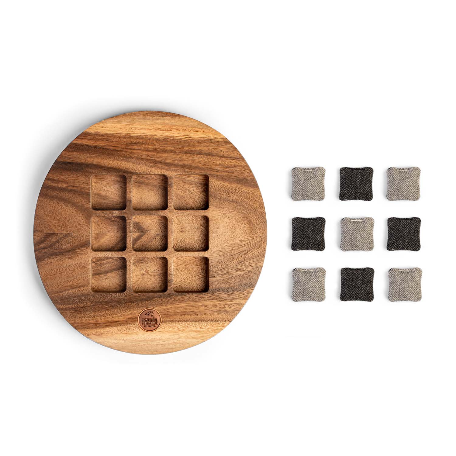 Wooden coaster set with square felt pads on a white background