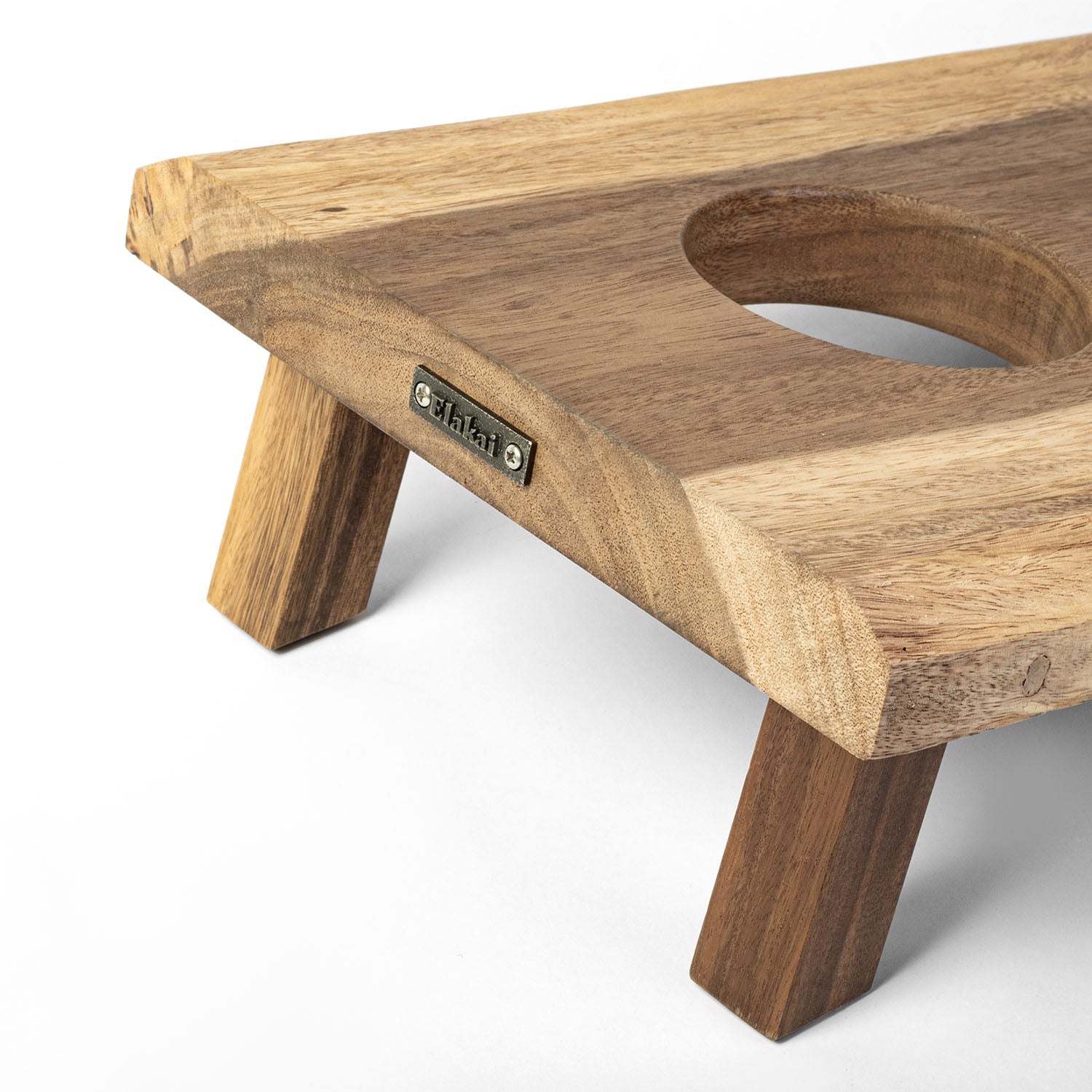 Wooden pet stand with a circular hole on a white background
