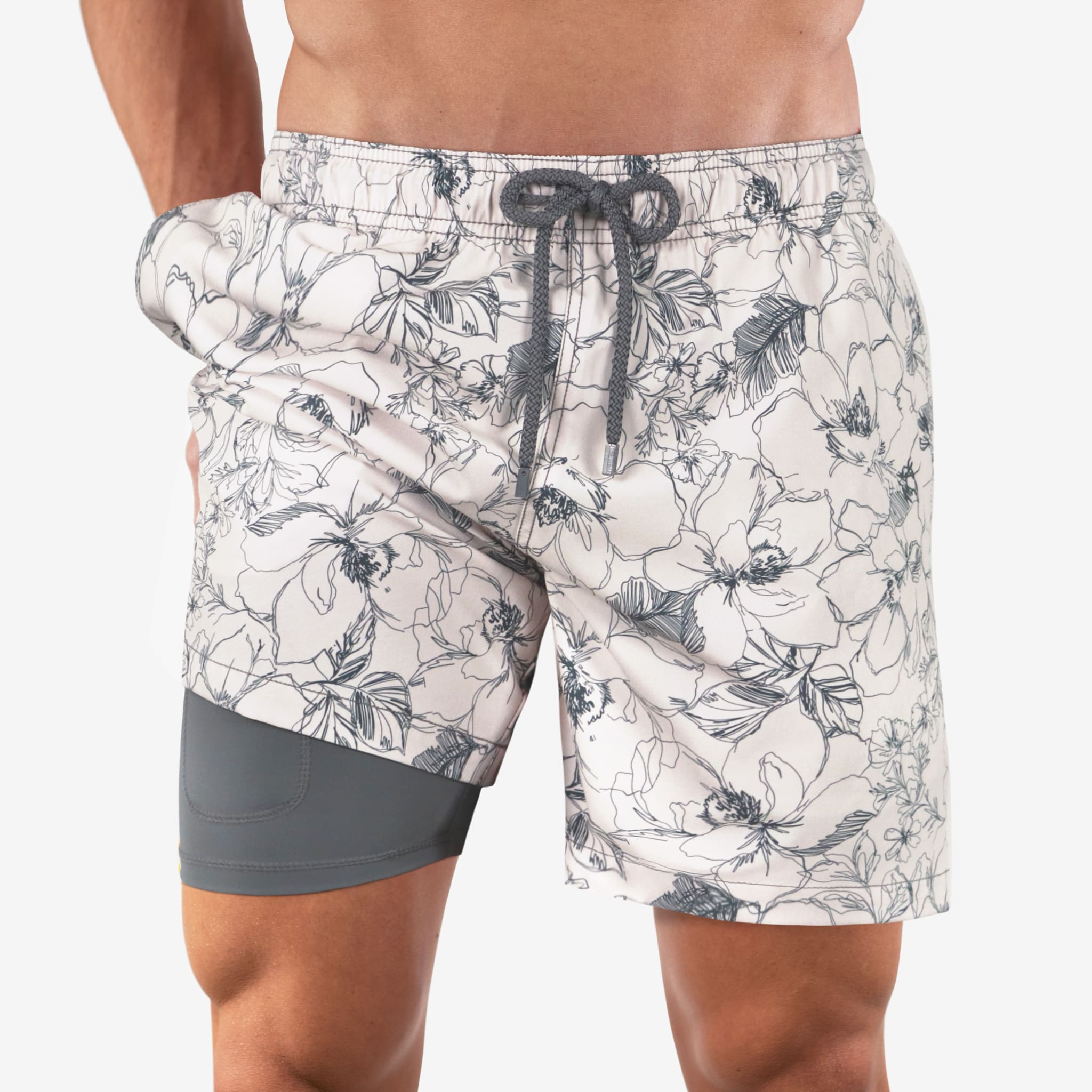Floral patterned shorts with a gray waistband and bottom section on a white background