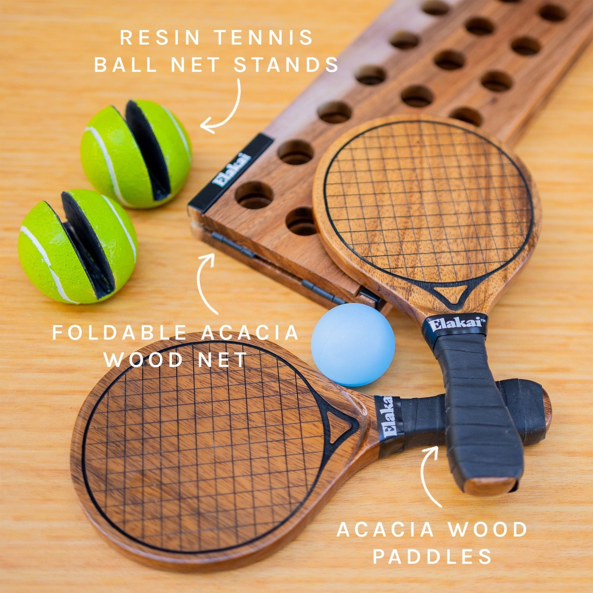 Wooden paddle tennis set with balls and stand on a wooden surface