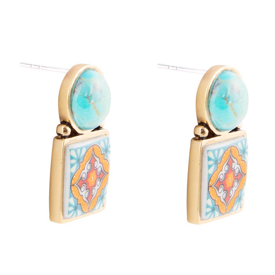 Pair of earrings with turquoise stones and colorful square designs on a white background