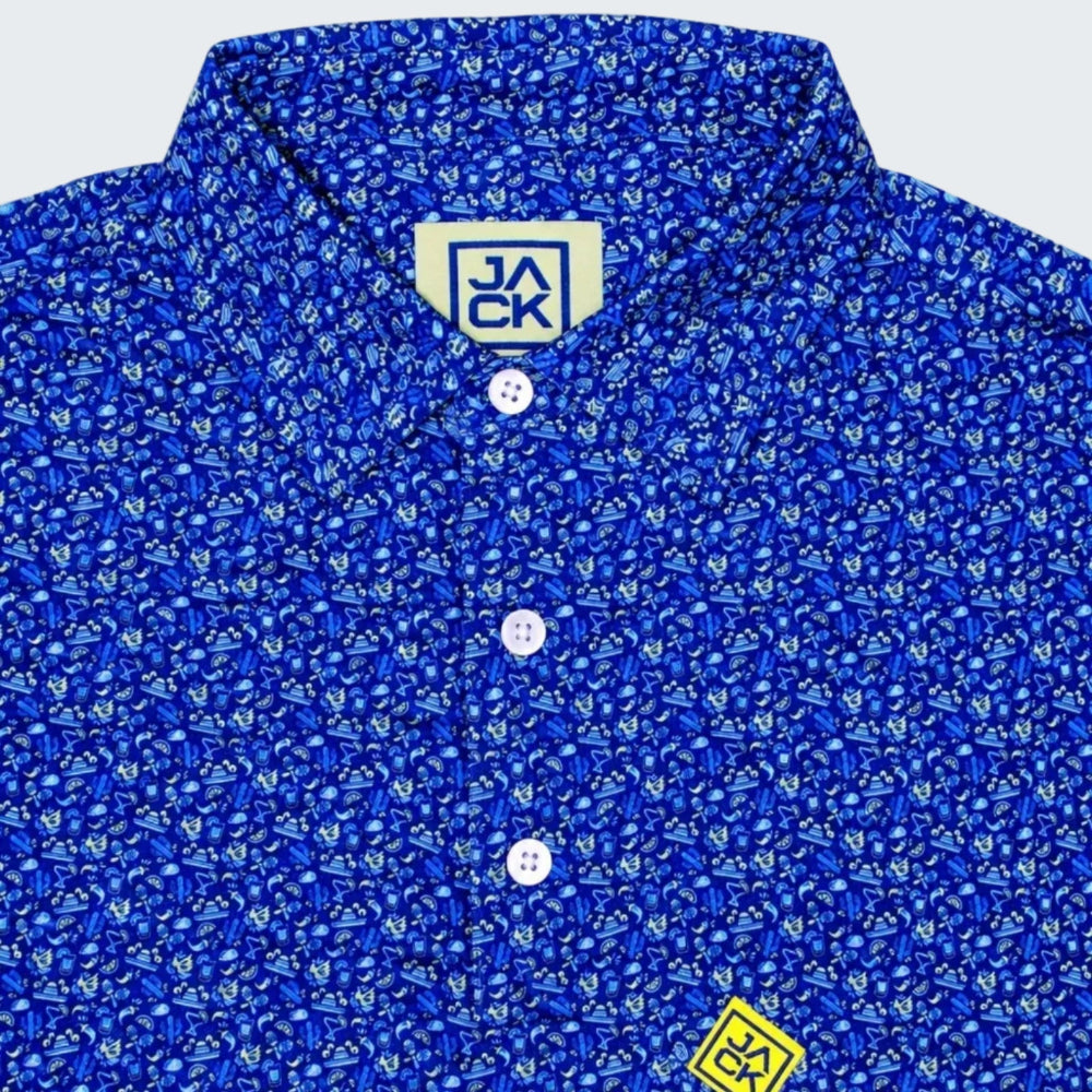 Close-up of a blue short-sleeve button-up shirt with a dense white and light blue micro-pattern, featuring a light beige inner neck label with 'JACK' and a yellow embroidered logo patch on the chest.