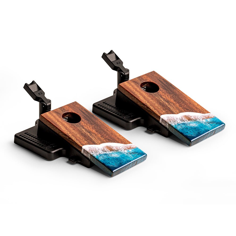 Two wooden and resin art pieces with ocean wave design on a white background