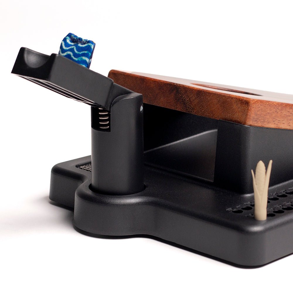 Close-up of a guitar capo with a white background