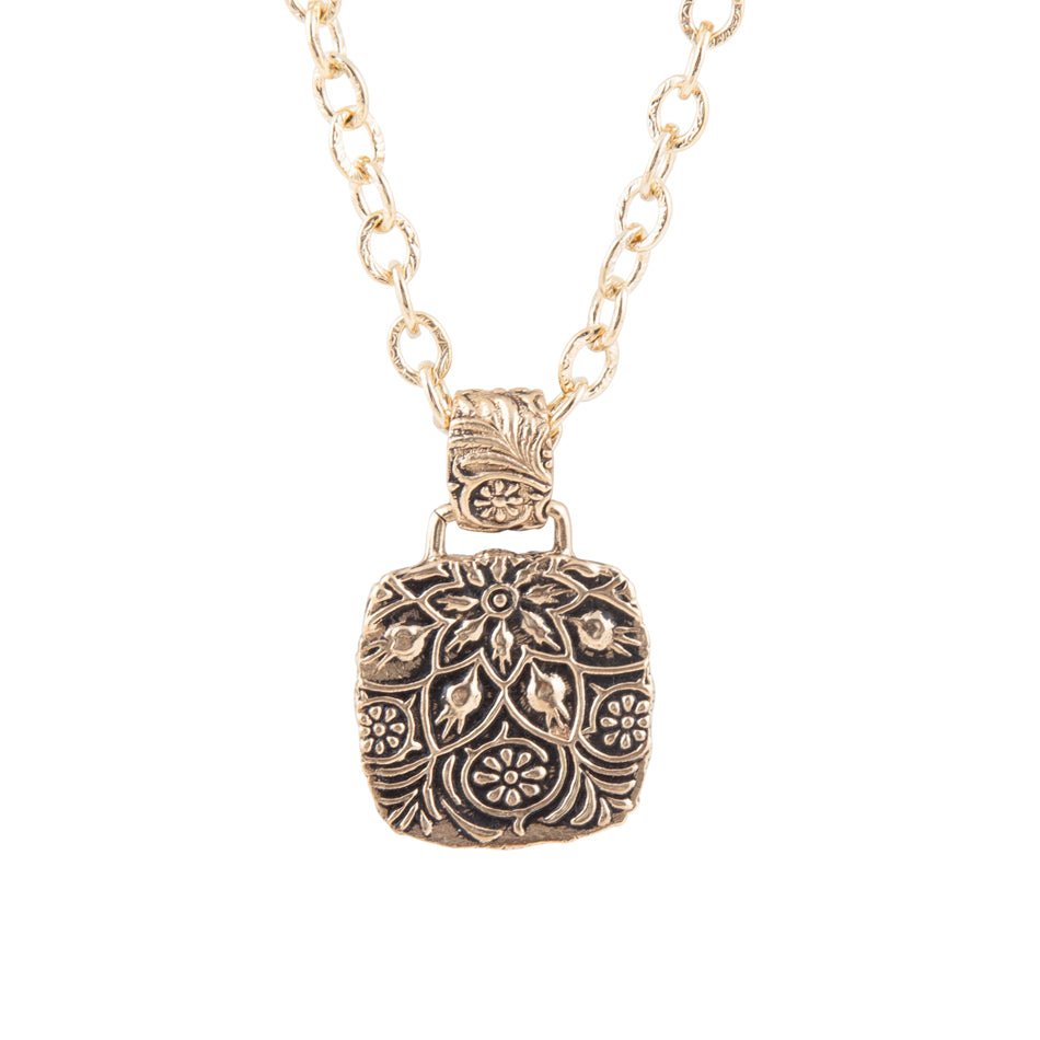 Decorative pendant necklace on a white background