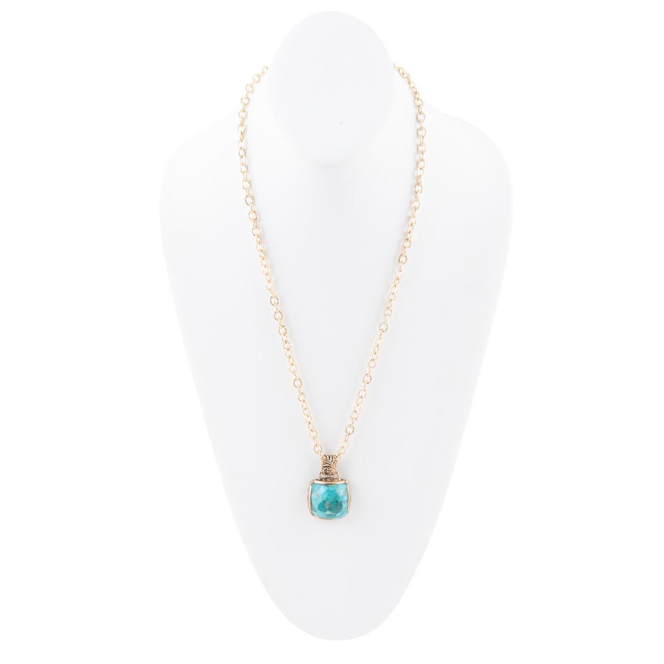 Necklace with a turquoise pendant on a white background