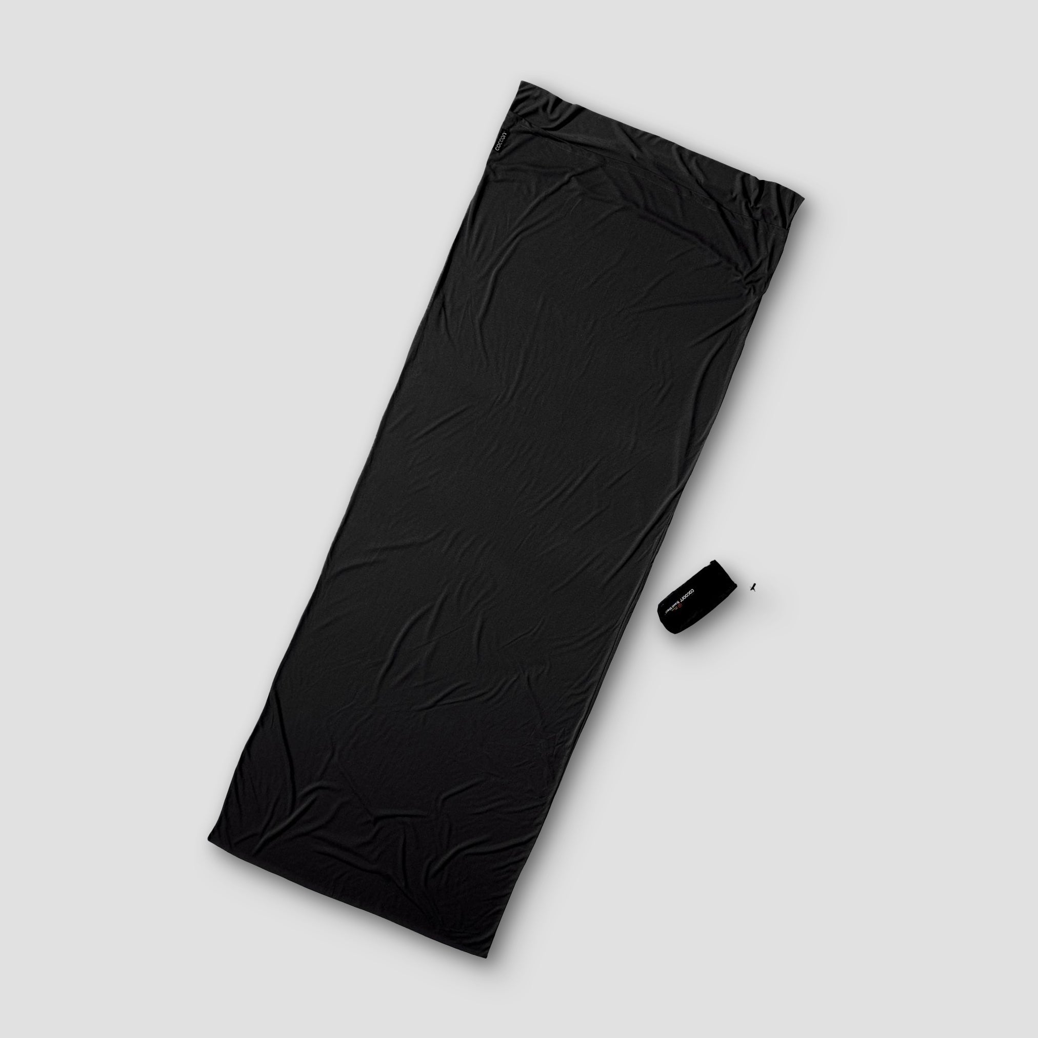 Black sleep bag on a light gray background