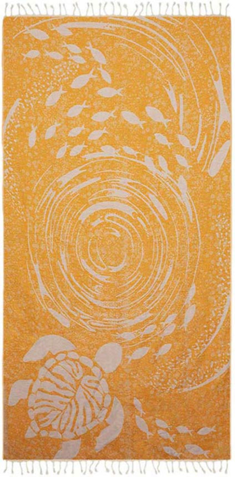 Orange towel with white turtle and fish pattern