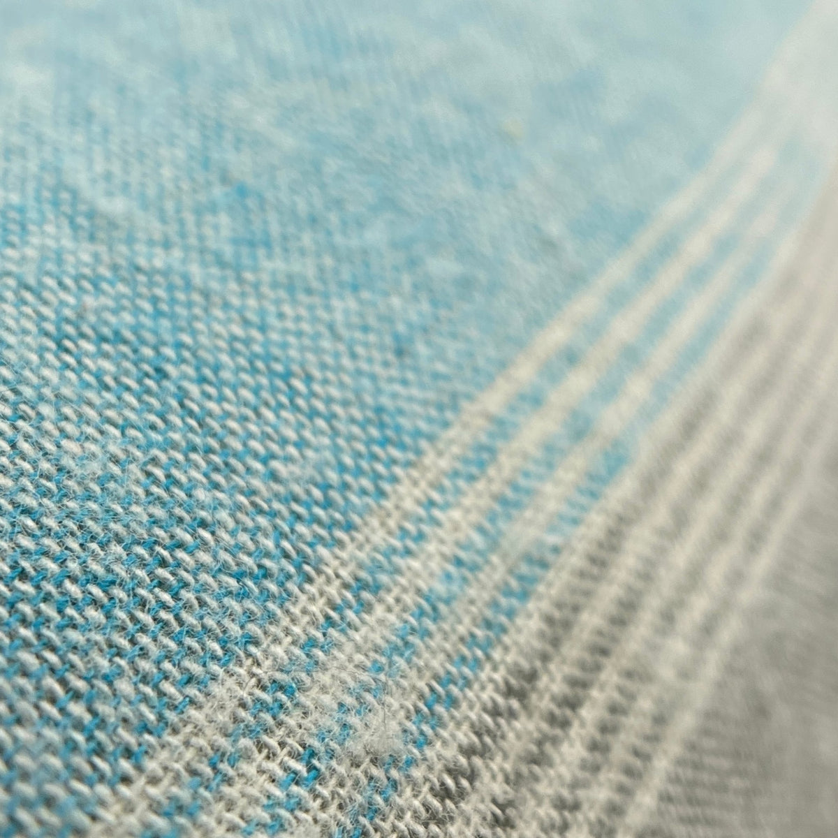 Close-up of a textured fabric with blue and gray colors