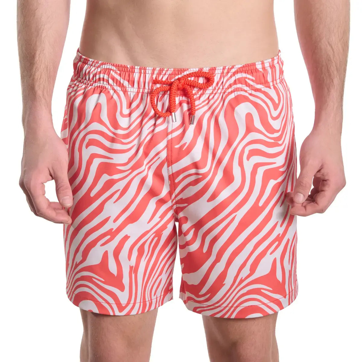 Red and white patterned swim shorts on a white background