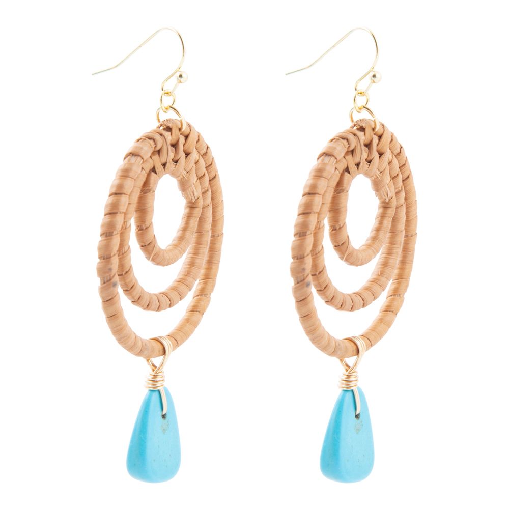 Pair of beaded earrings with blue teardrop pendants on a white background