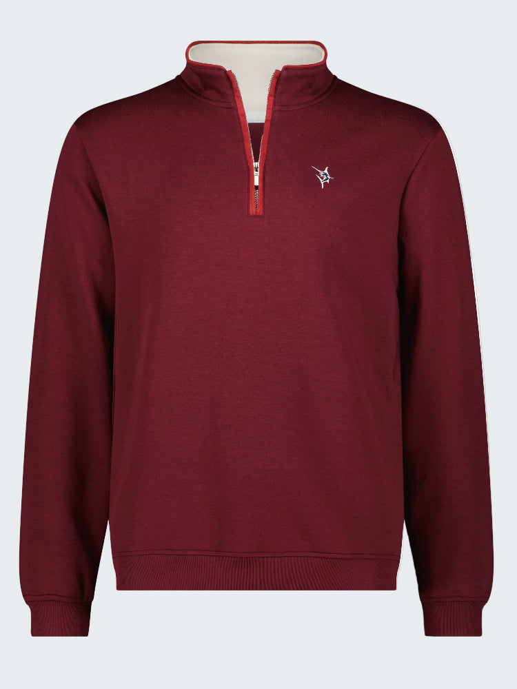 Maroon pullover with a small logo on a white background