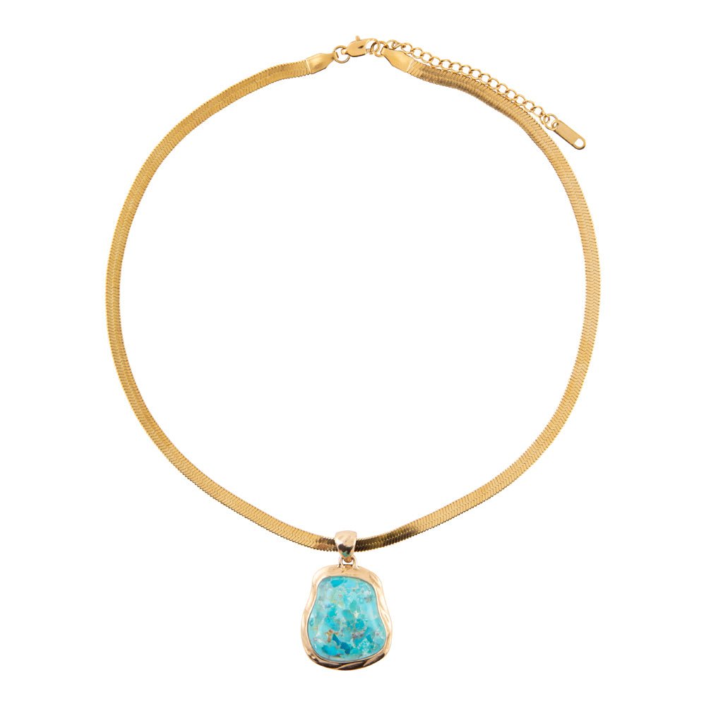 Gold necklace with a turquoise pendant on a white background
