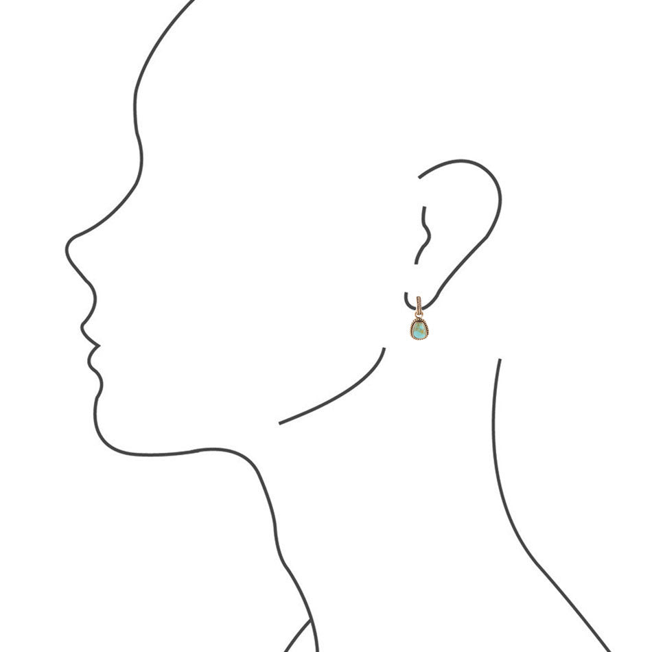 Outline of a person wearing an earring with a green gemstone on a white background