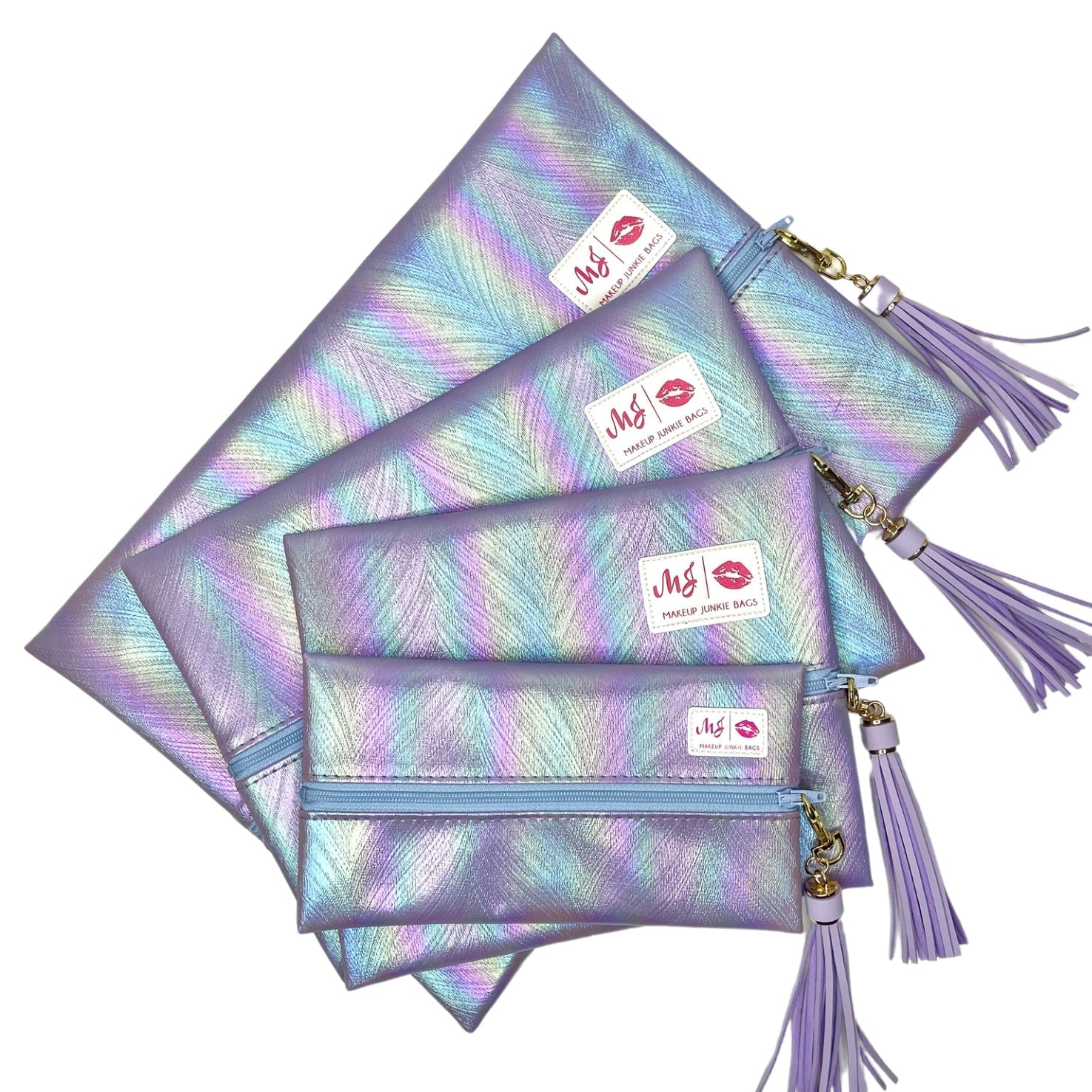 Set of four iridescent makeup bags with tassels on a white background