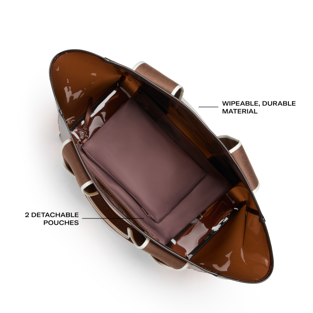 Brown leather bag with detachable pouches on a white background