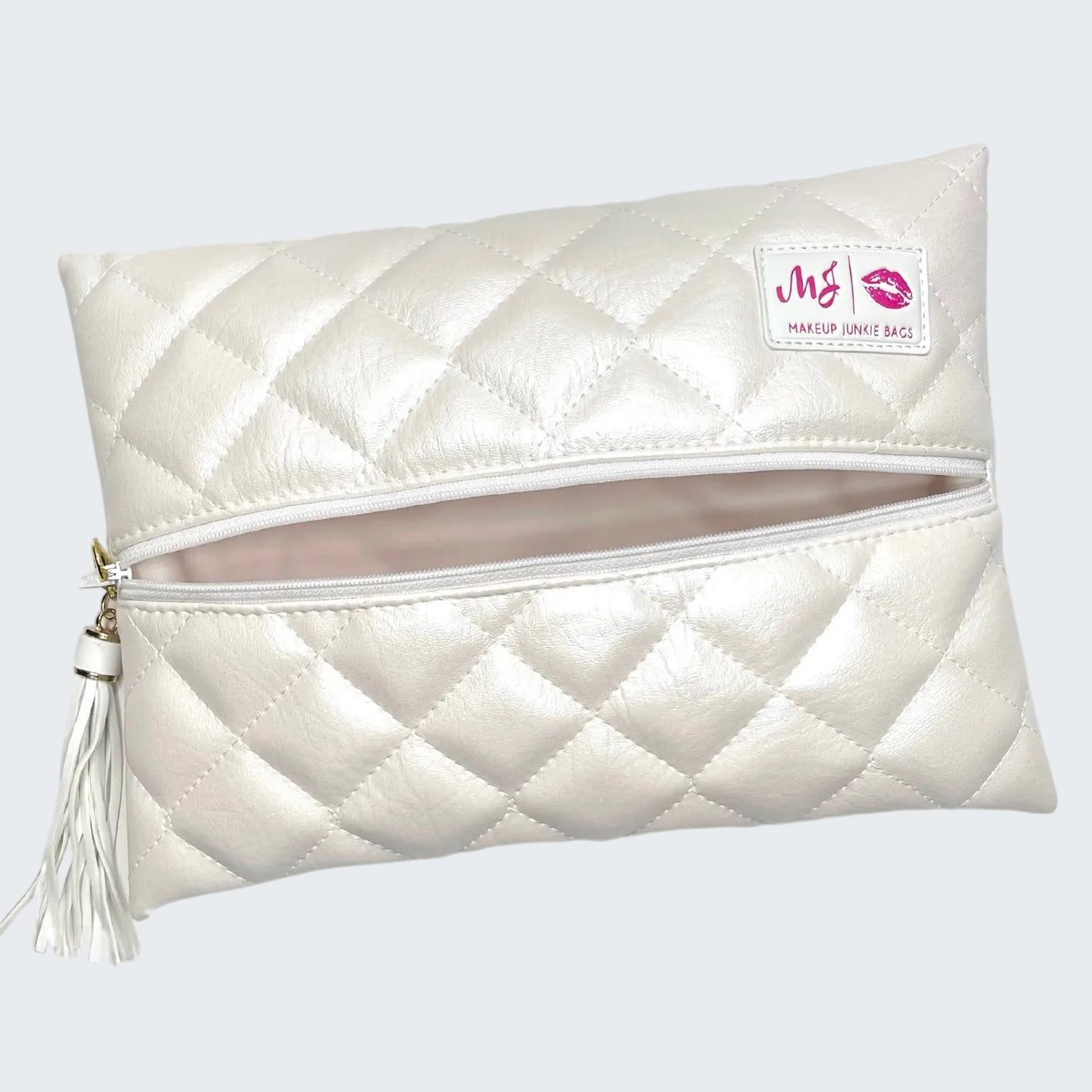 White quilted makeup bag with a visible brand logo on a white background