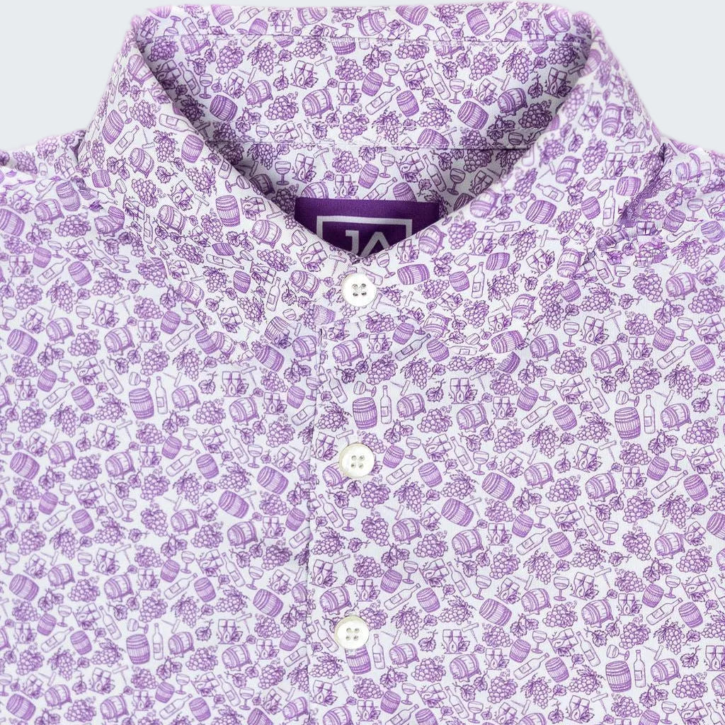 Close-up of a purple patterned shirt with a collar and buttons.