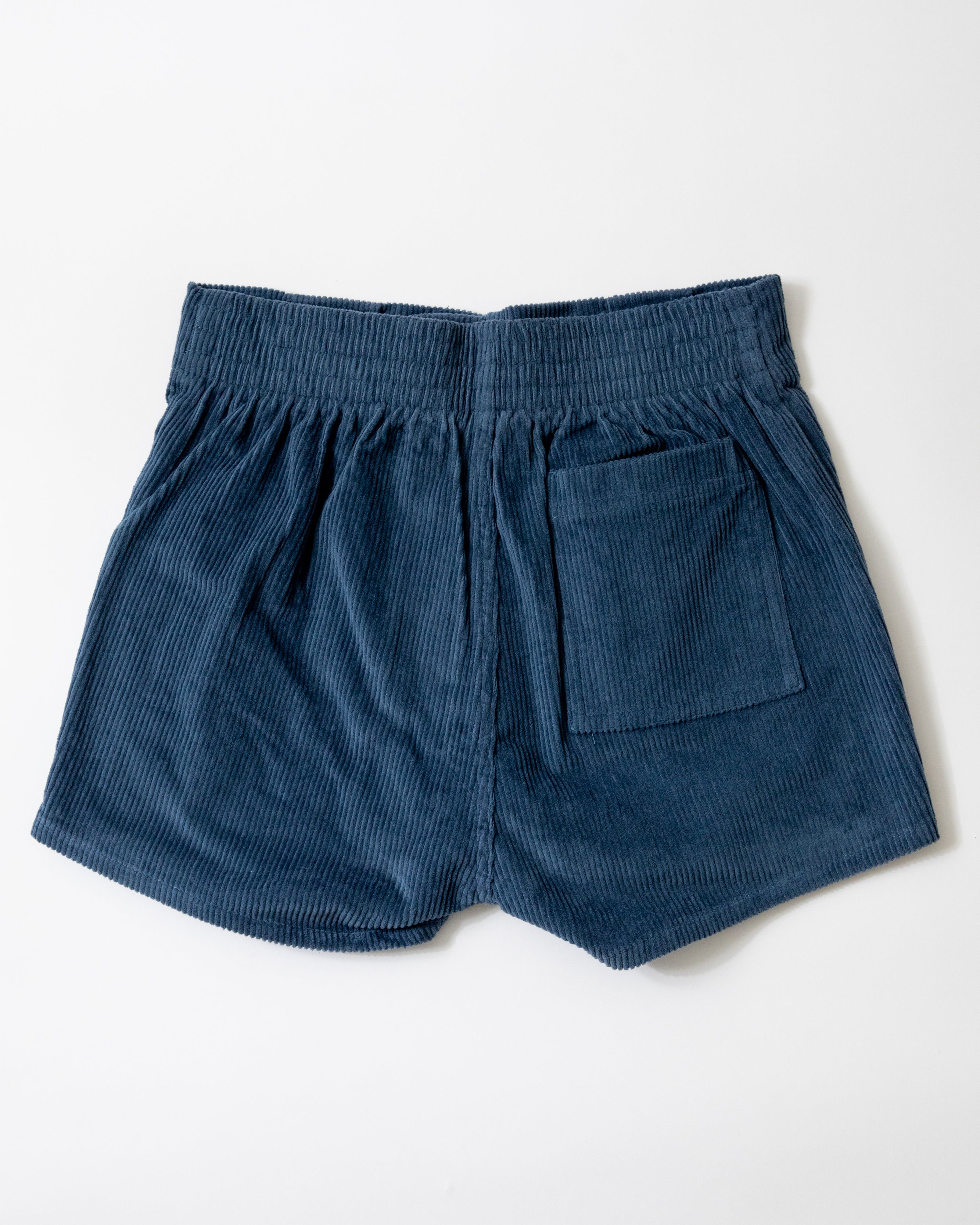 Blue corduroy shorts on a white background
