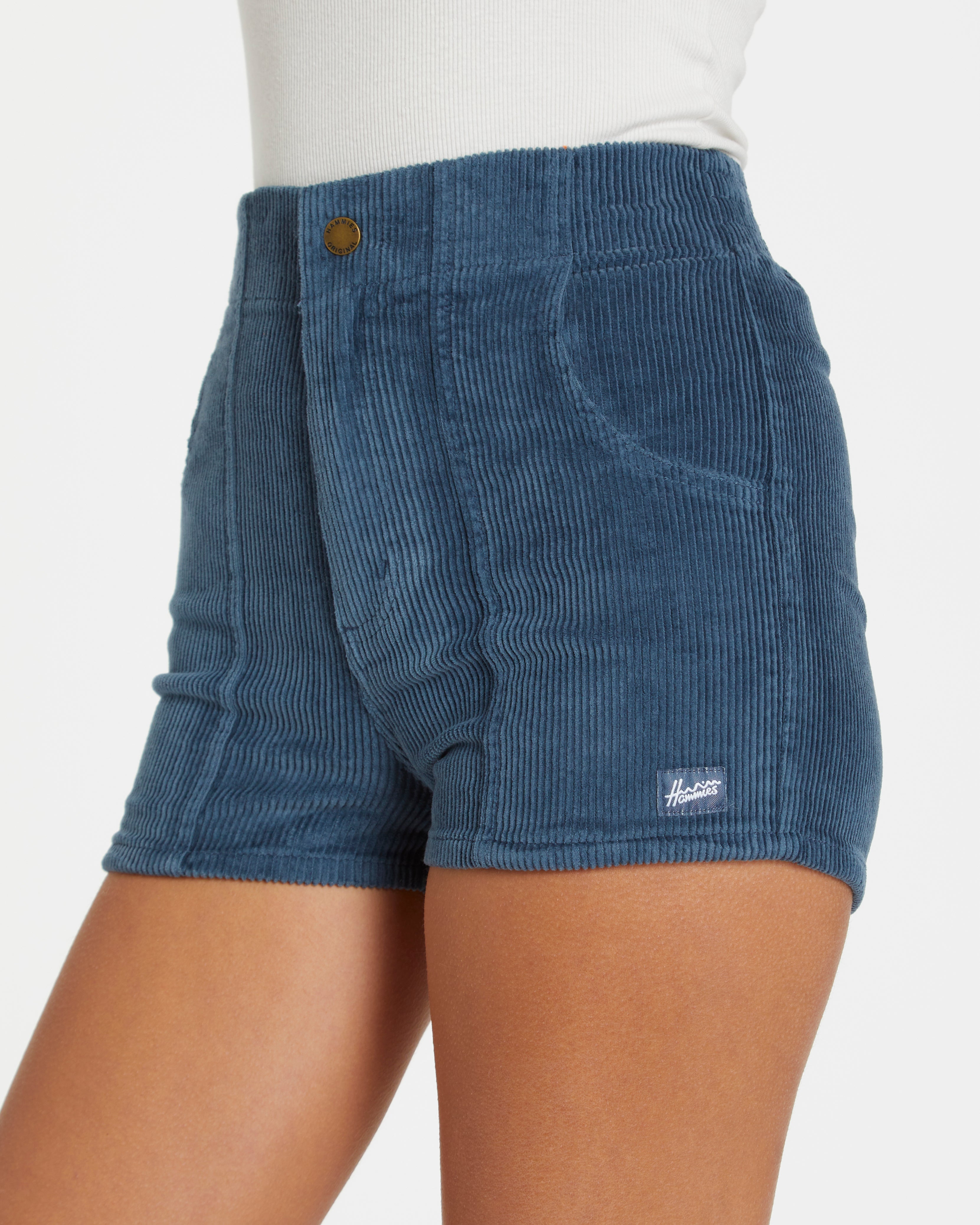 Blue corduroy shorts with a brand logo on a white background