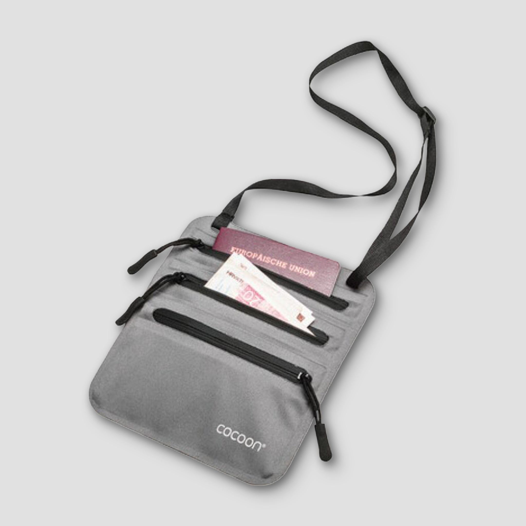 Gray crossbody bag with visible brand 'cocoon' on a light gray background