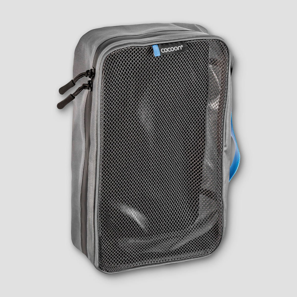 Gray travel packing cube with mesh pocket on a light gray background