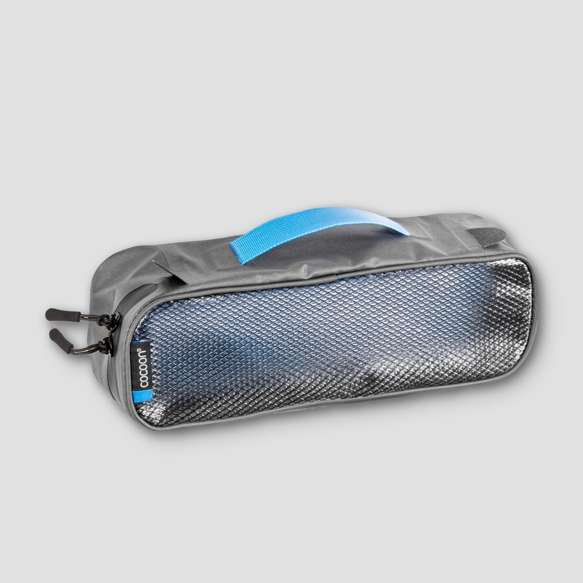 Gray toiletry bag with mesh side on a light gray background
