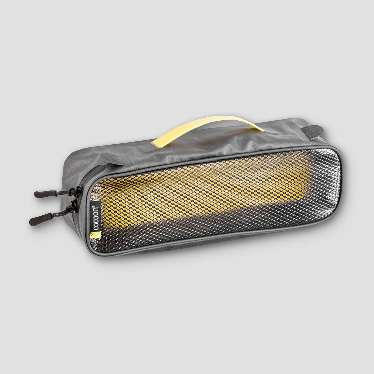 Gray and yellow travel pouch on a light gray background