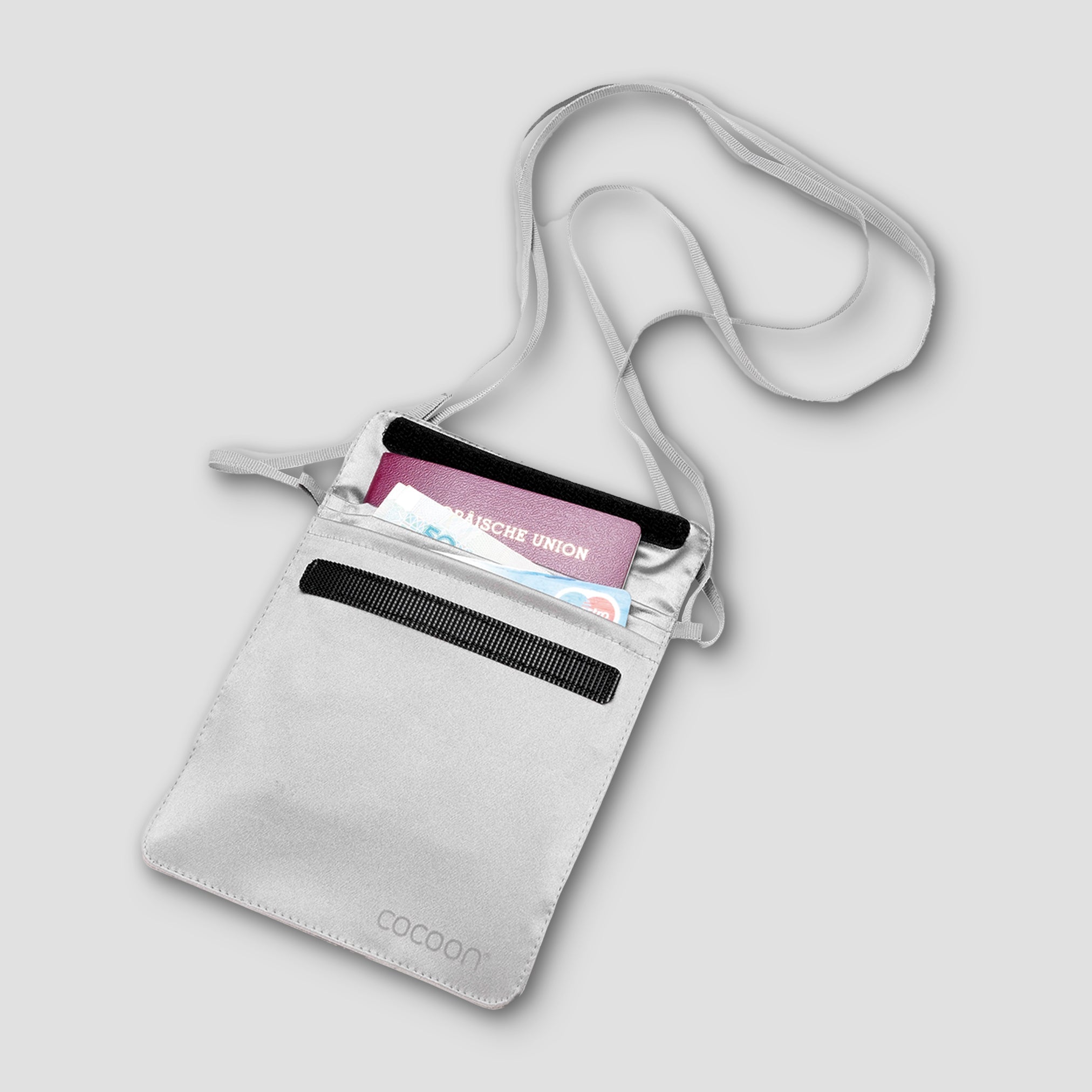 Gray crossbody bag with a strap on a light gray background