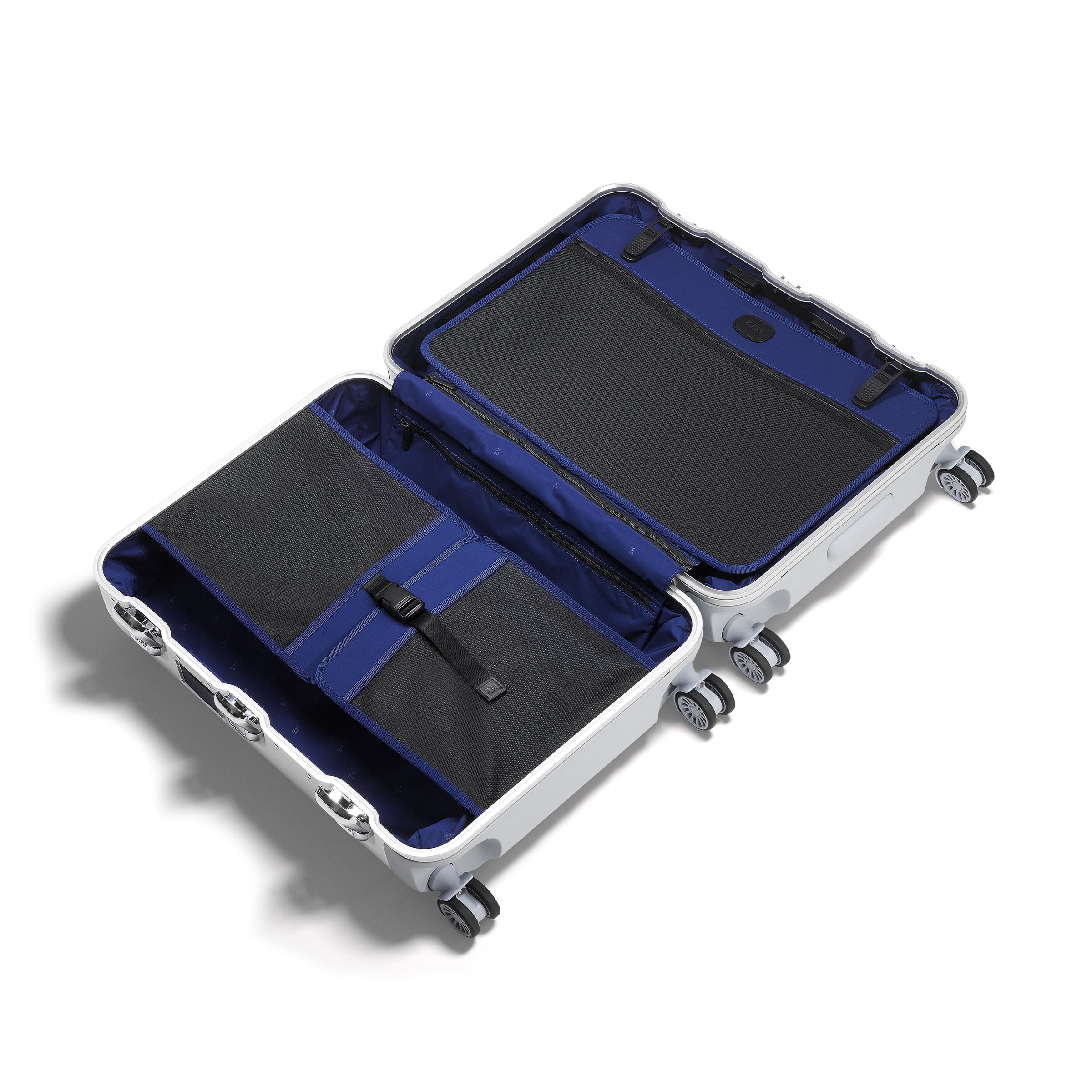 Open suitcase with blue interior on a white background