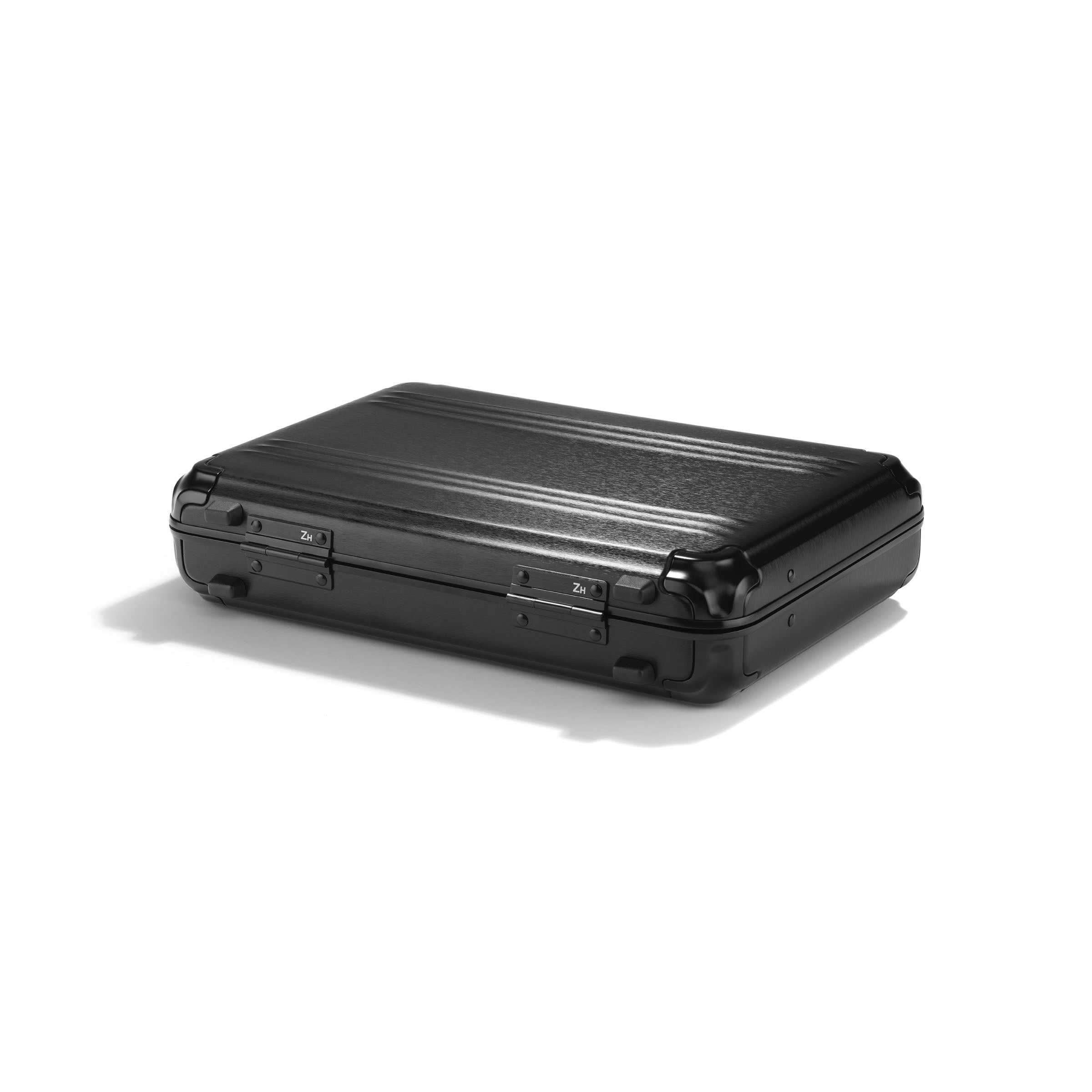 Black hard-shell suitcase on a white background