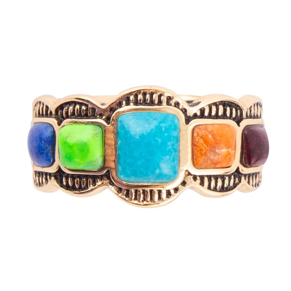 Gold ring with colorful gemstones on a white background