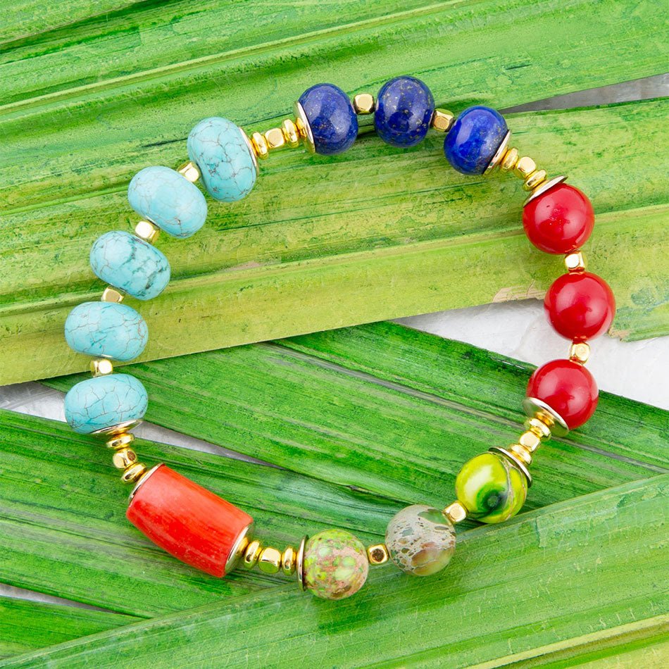 Colorful beaded bracelet on green leaves