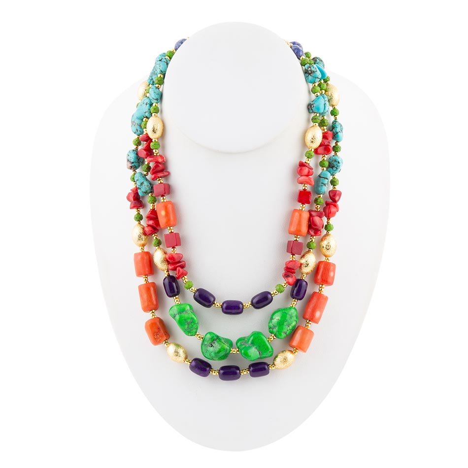 Colorful beaded necklace on a white mannequin bust